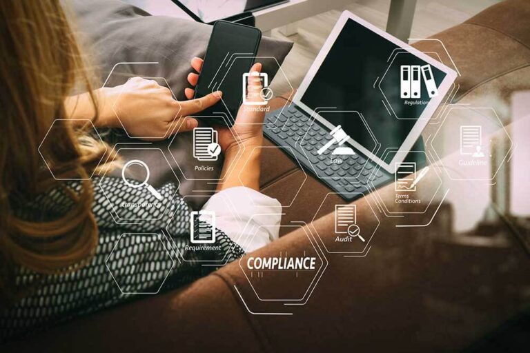 A woman is sitting on a couch with IT compliance.