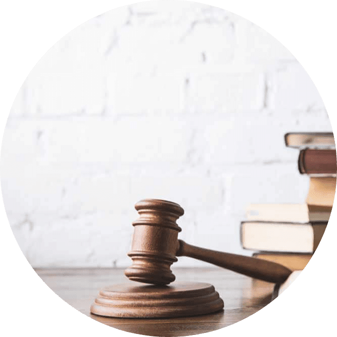 A judge gavel and books on a table in the IT solutions industry.