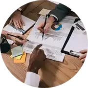 A group of people working at a table.