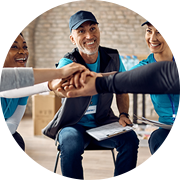 A group of people shaking hands in an office, emphasizing networking and collaboration in managed IT.