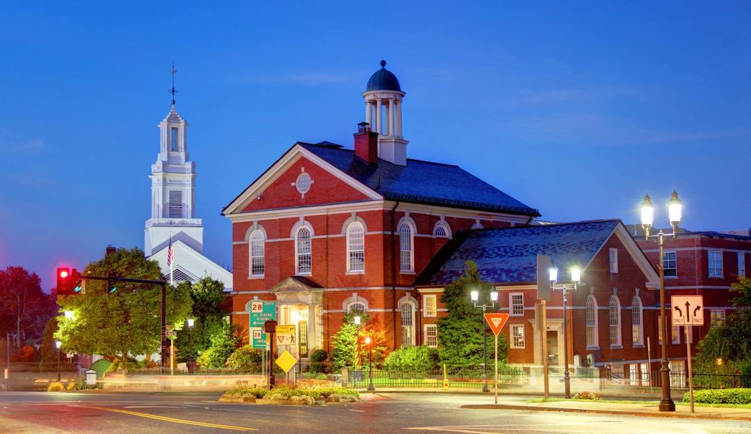 A building with a steeple and a white tower in Andover. A building with a steeple and a white tower in Andover.