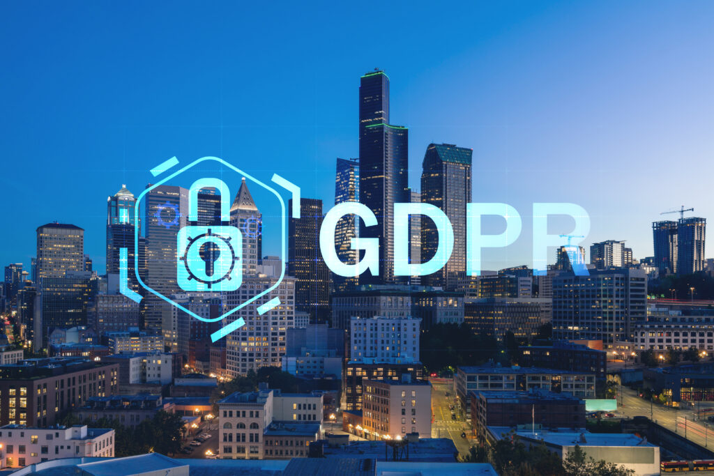 Illuminated aerial cityscape of Seattle, downtown at night time, Washington, USA. GDPR hologram, concept of data protection regulation and privacy for all individuals