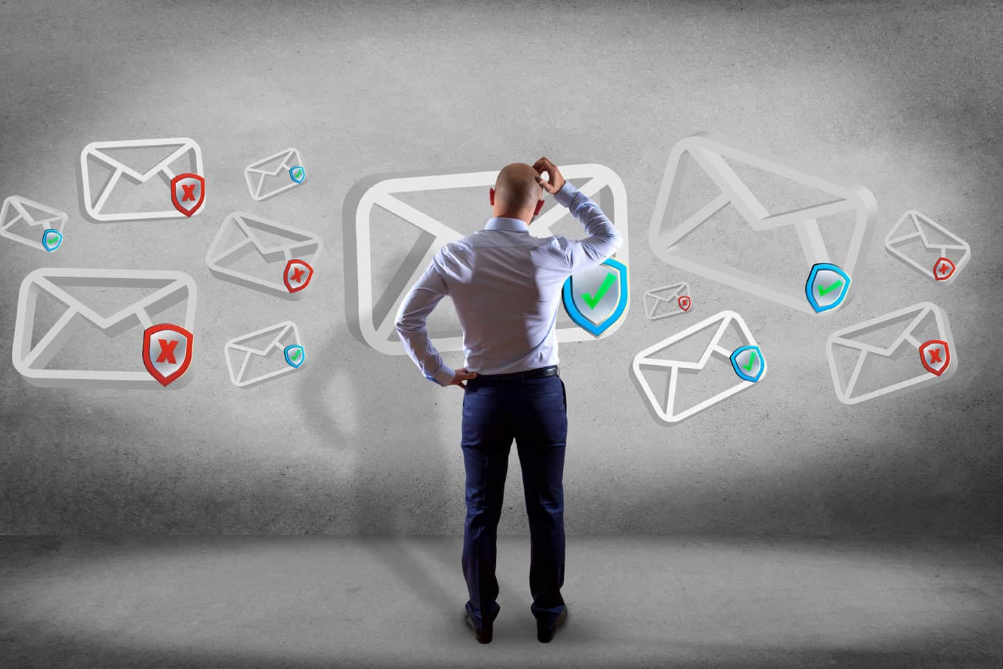 A man stands scratching his head, facing floating icons of email envelopes—some with check marks, others with red Xs—highlighting email authentication for business and the need to prevent email spoofing.
