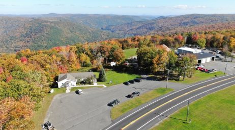 An aerial view of a road winding through the mountains.